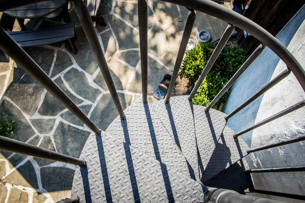 Small mountain style metal spiral open staircase photo in Philadelphia