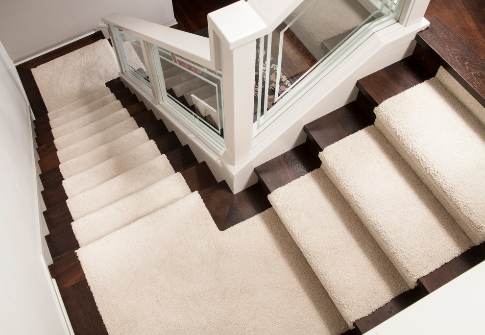Example of a mid-sized classic carpeted u-shaped staircase design in Orange County with carpeted risers