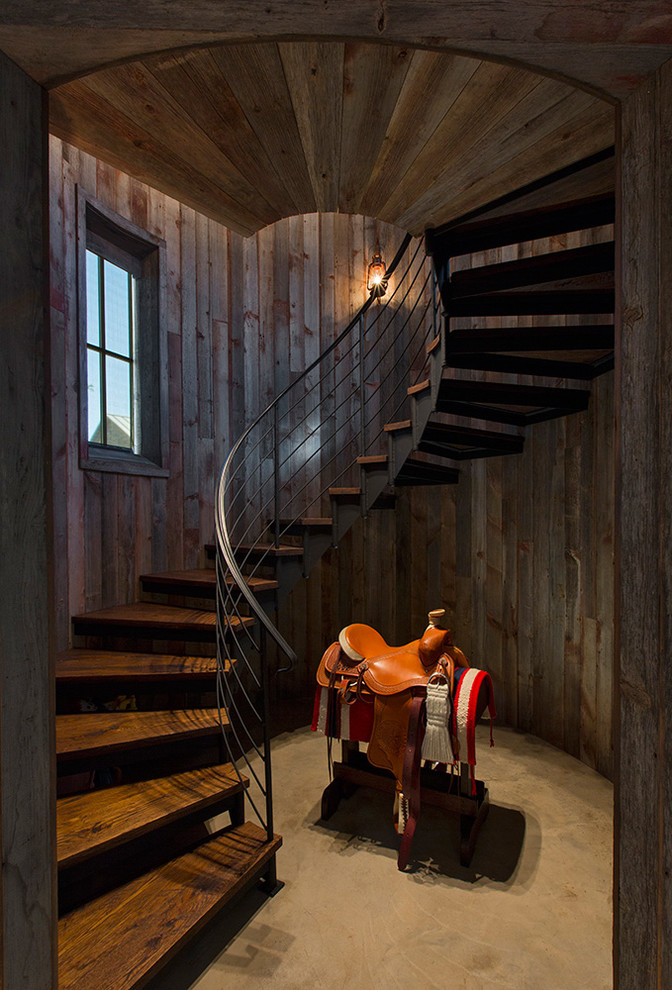 Inspiration for a rustic wood curved staircase in Austin with open risers.
