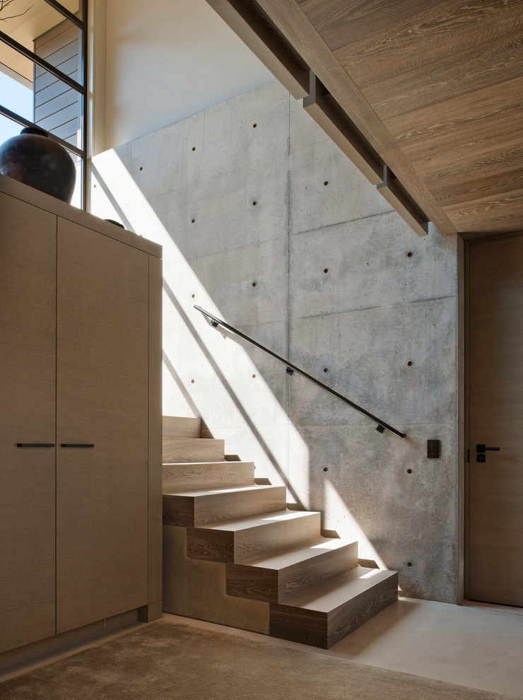 Inspiration for a contemporary wood staircase in Seattle with wood risers.