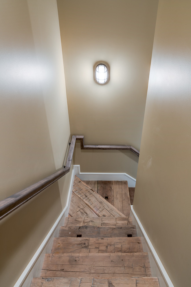 Example of a small mountain style wooden l-shaped staircase design in Other with wooden risers