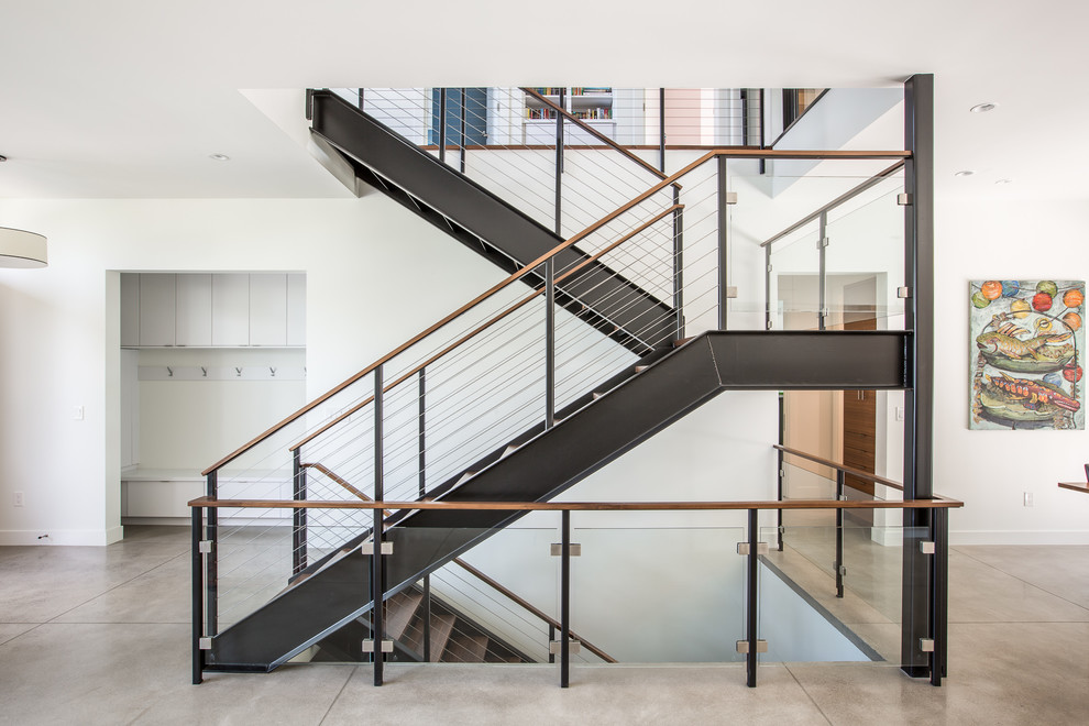 Contemporary wood u-shaped mixed railing staircase in Denver with open risers.