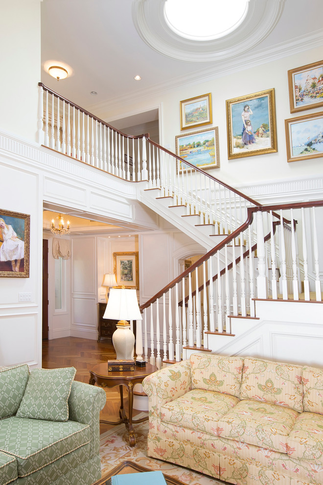 Large elegant carpeted u-shaped staircase photo in San Diego with carpeted risers