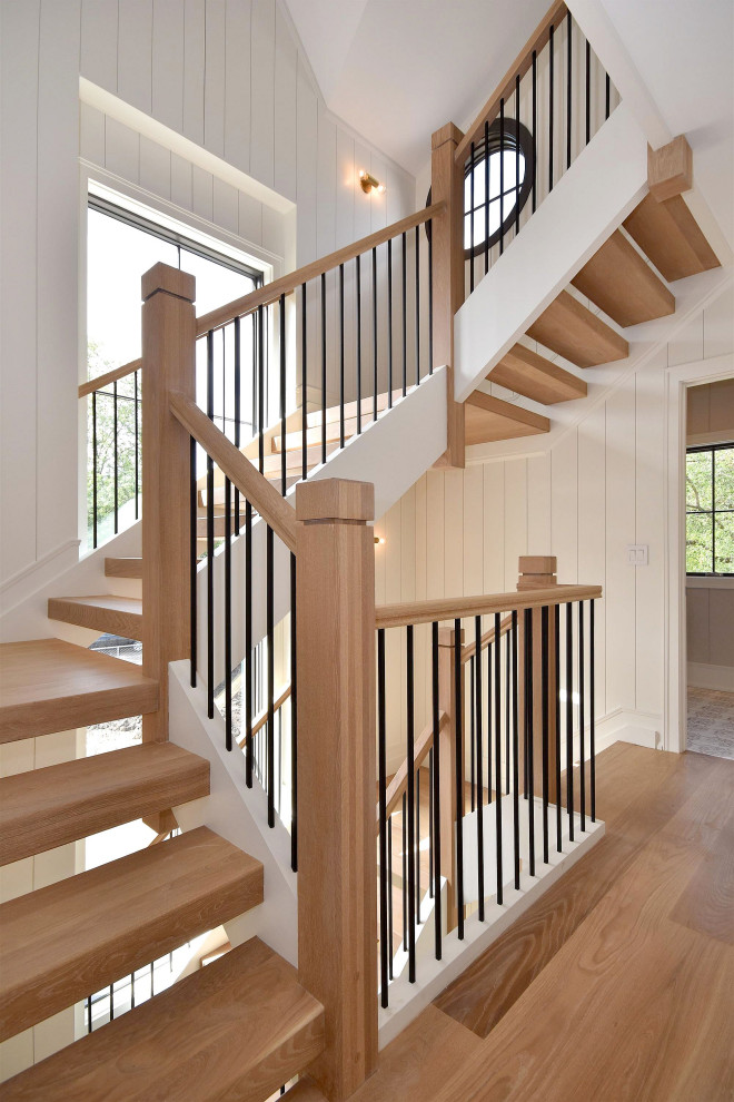 Ejemplo de escalera contemporánea sin contrahuella con escalones de madera y barandilla de madera