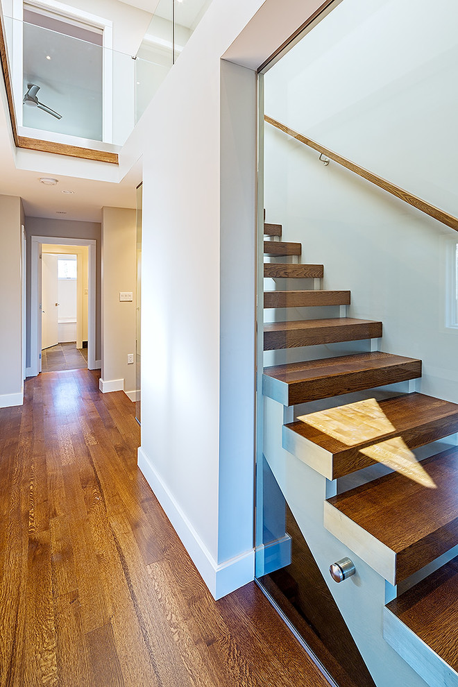 Staircase - small contemporary wooden straight open staircase idea in Toronto