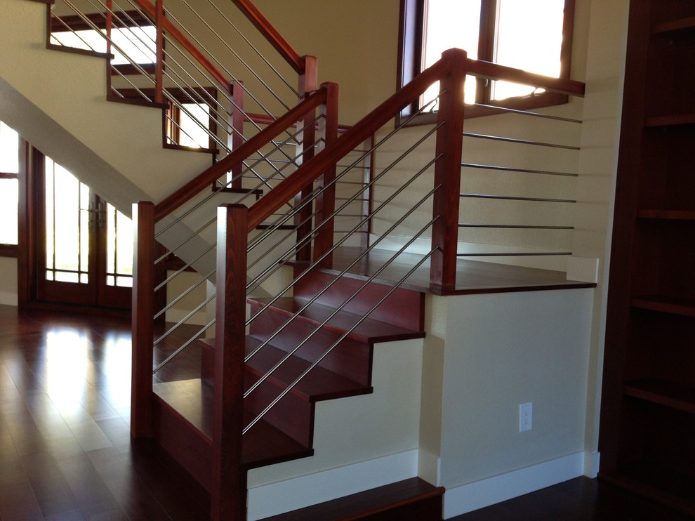 Design ideas for a medium sized contemporary curved staircase in San Diego.