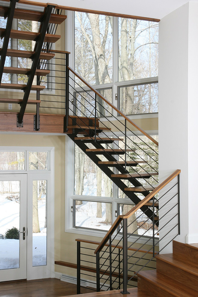 Large contemporary wood floating staircase in Other.