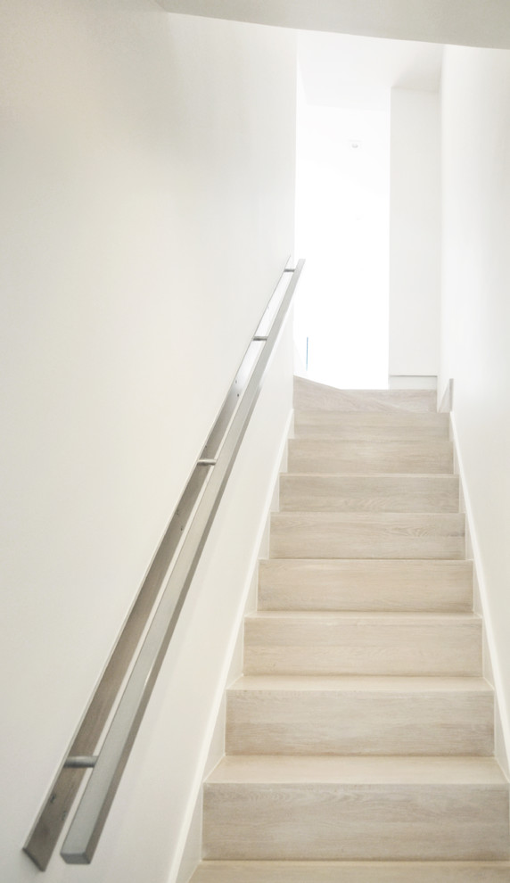 Inspiration for a small contemporary wood straight staircase in DC Metro with wood risers.