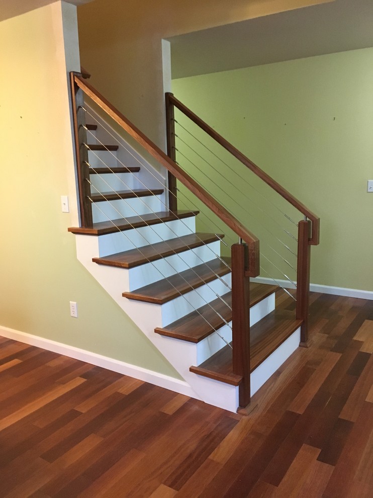 Inspiration for a mid-sized transitional wooden straight mixed material railing staircase remodel in Seattle with painted risers