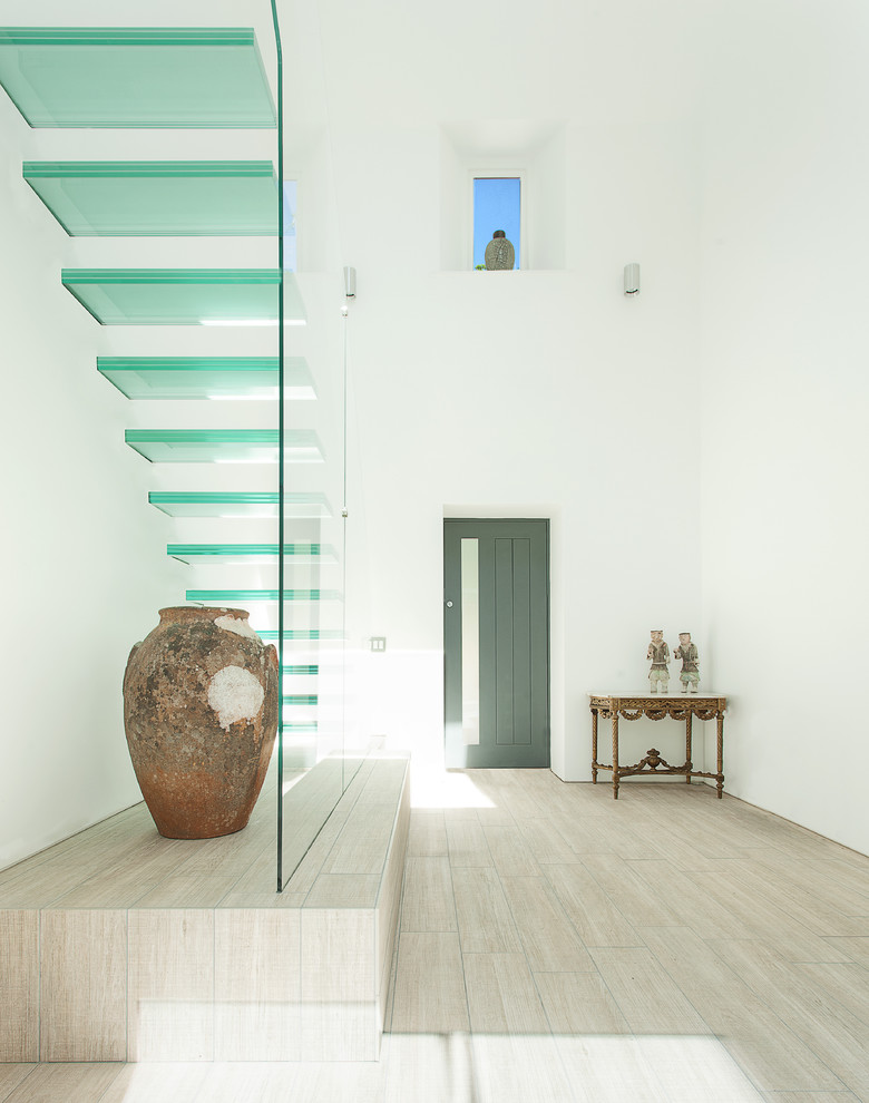 Inspiration for a contemporary glass open staircase remodel in Hampshire