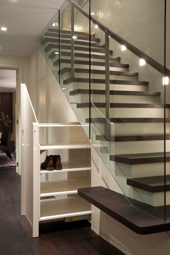 Staircase - contemporary wooden straight staircase idea in London