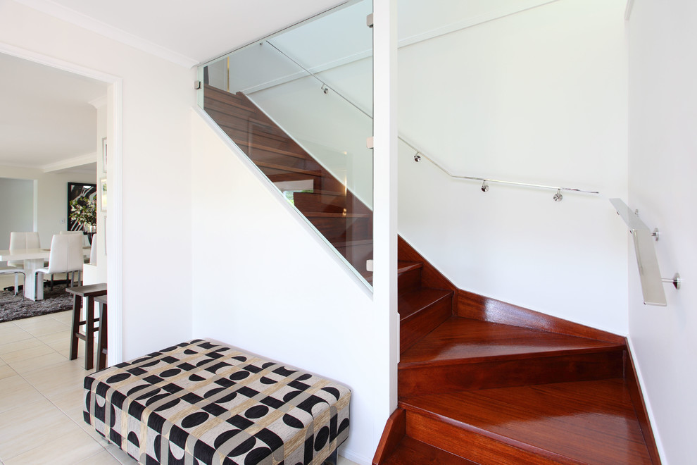 This is an example of a contemporary wood staircase in Brisbane with wood risers.