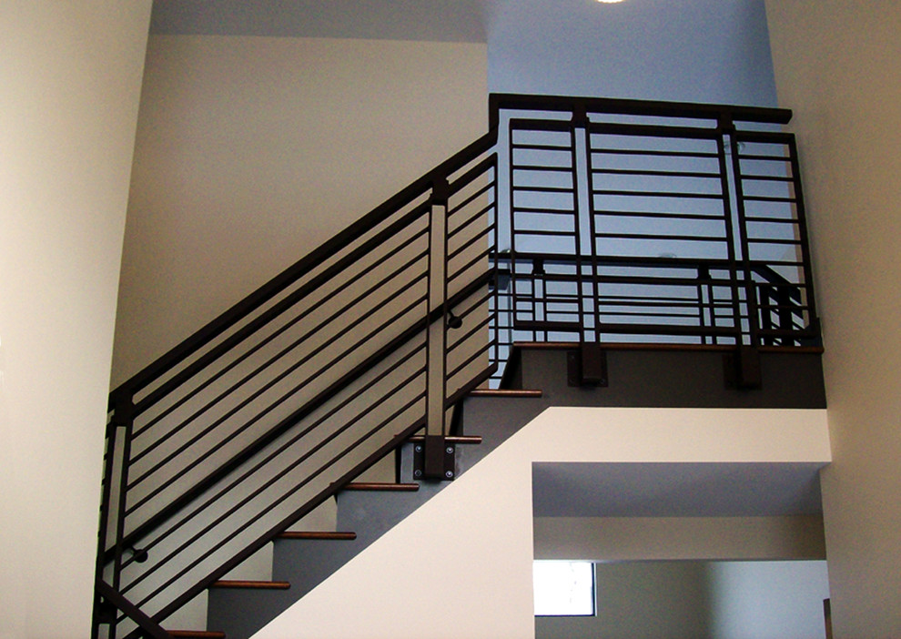 Example of a mid-sized trendy wooden u-shaped staircase design in Other with painted risers
