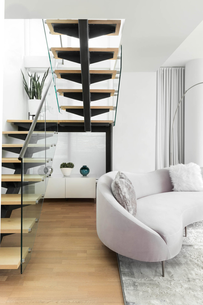 Staircase - contemporary wooden floating open and glass railing staircase idea in Toronto