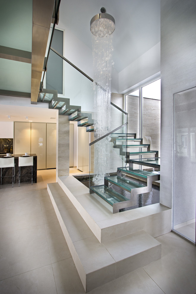 Diseño de escalera en U, actual, grande, sin contrahuella, con escalones de vidrio