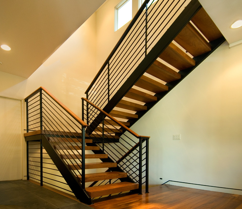 Inspiration for a medium sized contemporary wood floating staircase in Minneapolis with open risers.