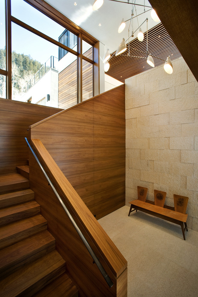 Inspiration pour un escalier design en L avec des marches en bois et des contremarches en bois.