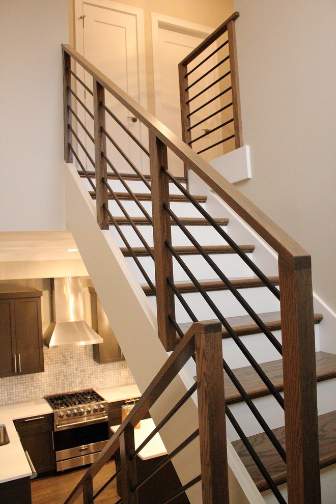 Inspiration for a mid-sized contemporary wooden u-shaped metal railing staircase remodel in Chicago with painted risers