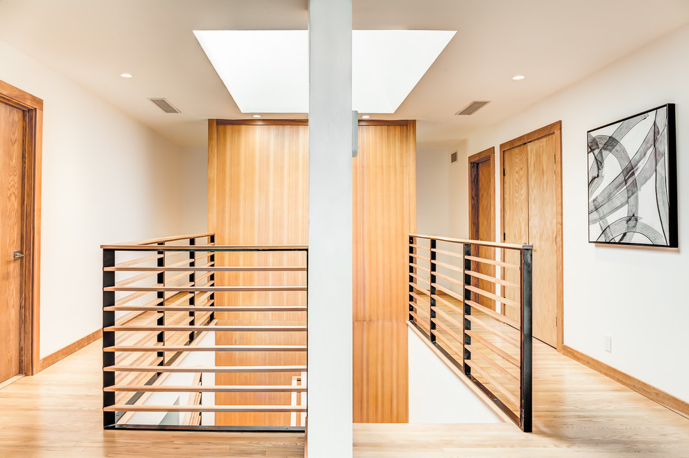 Design ideas for a large contemporary wood u-shaped mixed railing staircase in San Francisco.