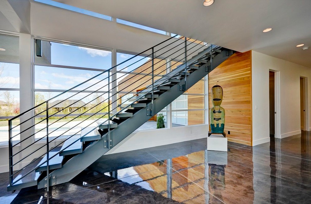 This is an example of a contemporary straight staircase in Boise with open risers.