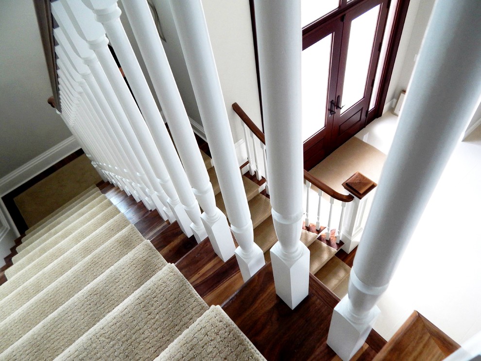 Design ideas for a traditional wood wood railing staircase in Other with wood risers.