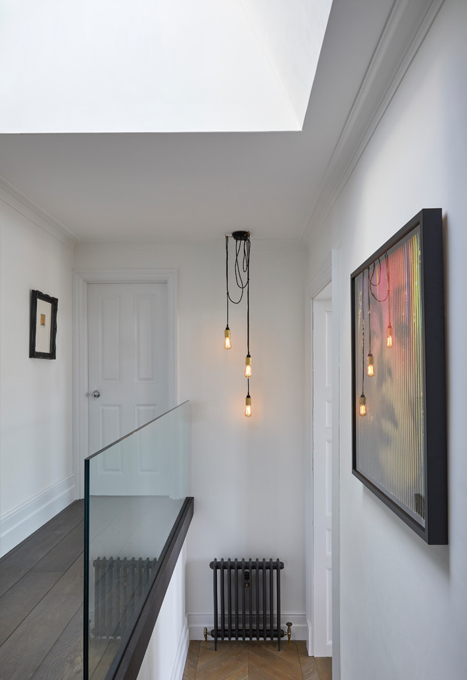 This is an example of a traditional staircase in Hertfordshire with feature lighting.