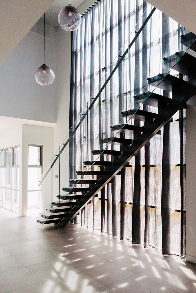 Staircase - contemporary wooden straight staircase idea in Sydney