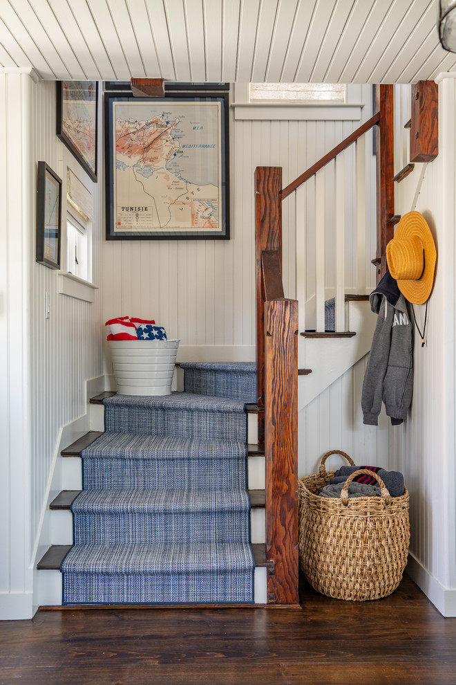 Inspiration for a coastal wooden l-shaped wood railing staircase remodel in Other with painted risers