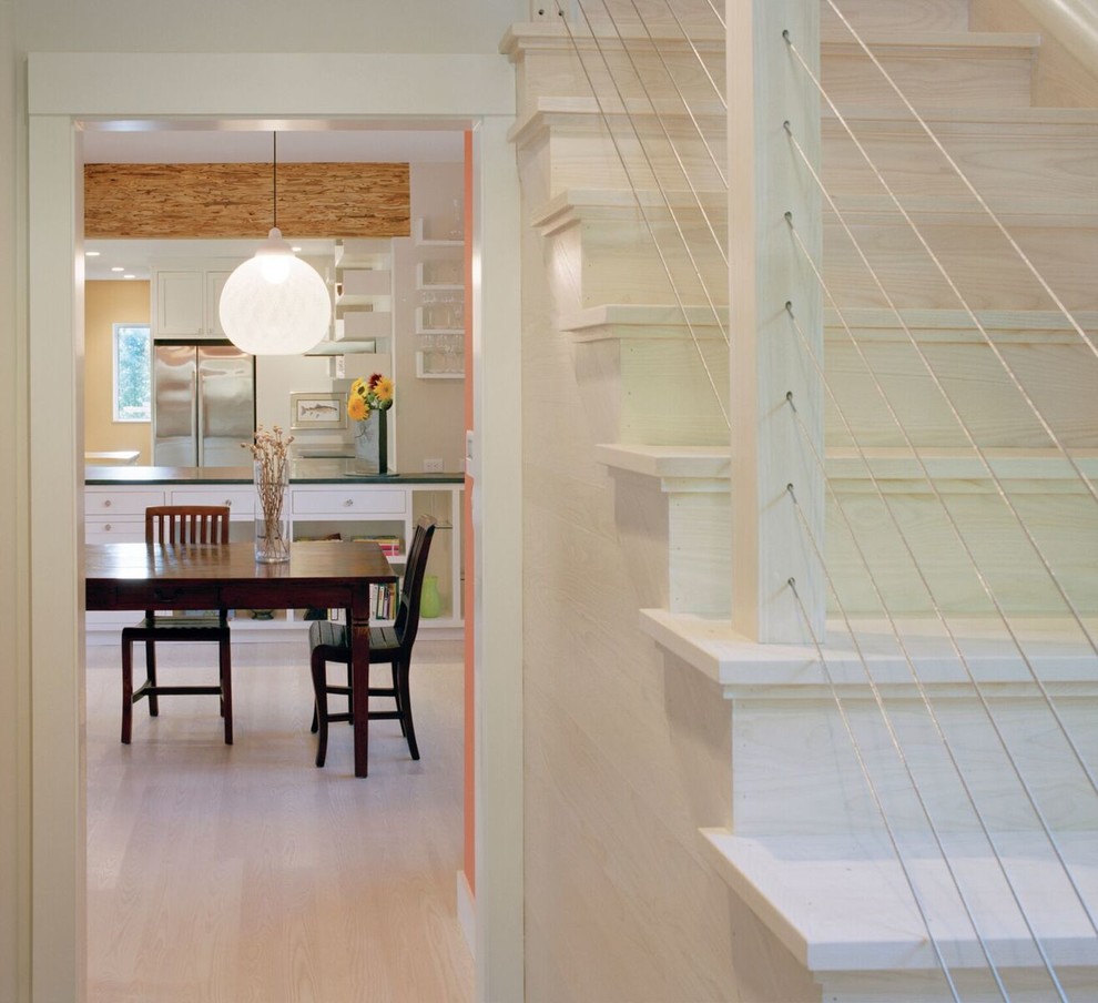 Mid-sized urban wooden straight staircase photo in Boston with wooden risers