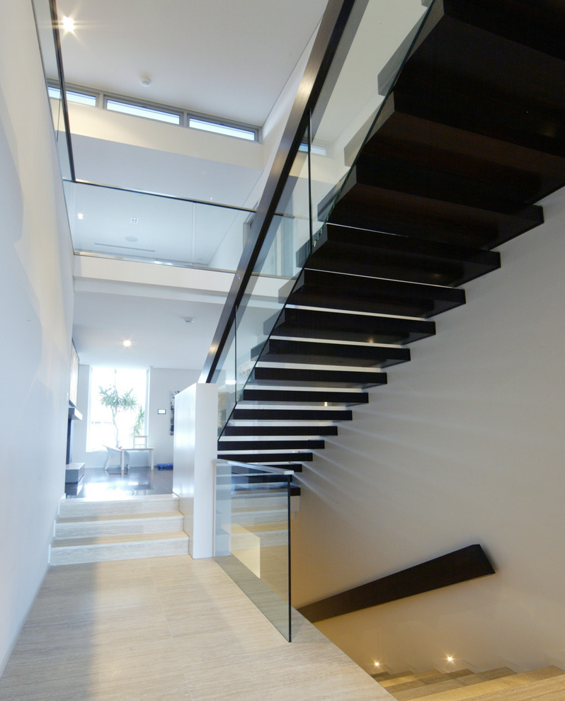 Photo of a contemporary wood floating staircase in Perth with open risers.