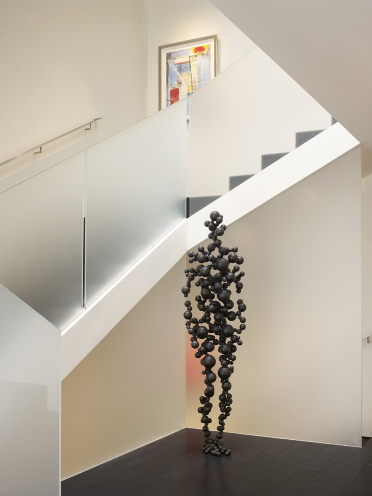 This is an example of a contemporary staircase in San Francisco with under stair storage.