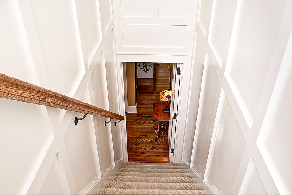 Example of an arts and crafts staircase design in Charlotte