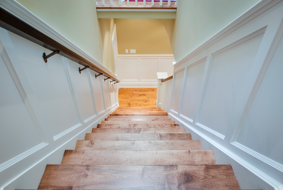 Medium sized traditional wood straight staircase in Toronto with painted wood risers.