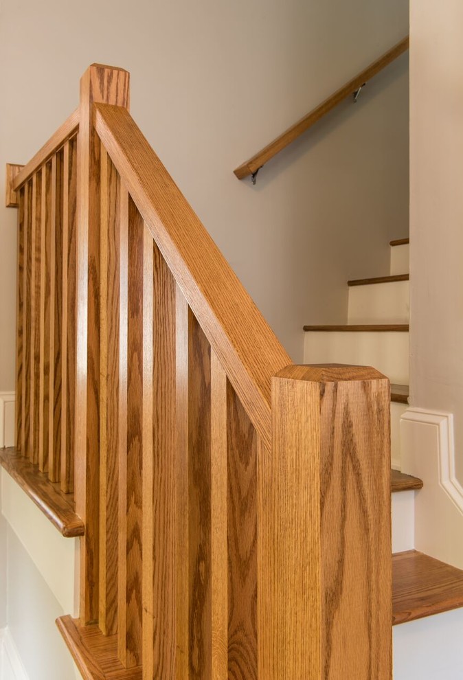 This is an example of a medium sized contemporary wood l-shaped staircase in Atlanta with painted wood risers.