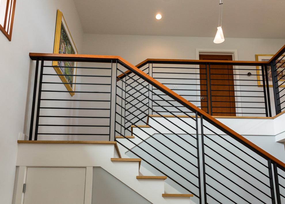 Design ideas for a contemporary wood u-shaped staircase in San Francisco with painted wood risers.