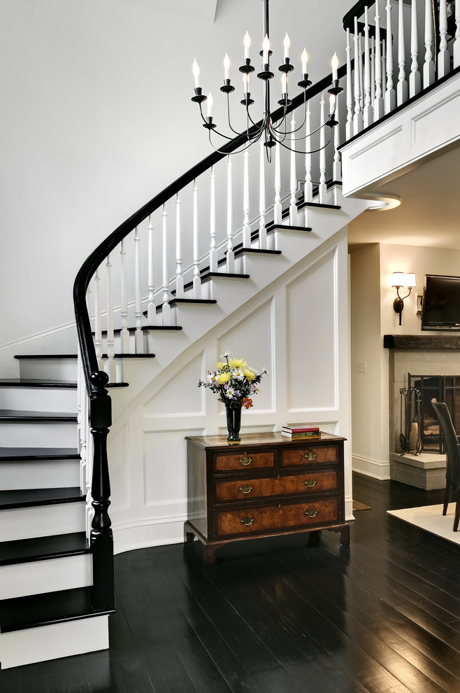 Staircase - traditional wooden curved staircase idea in New York