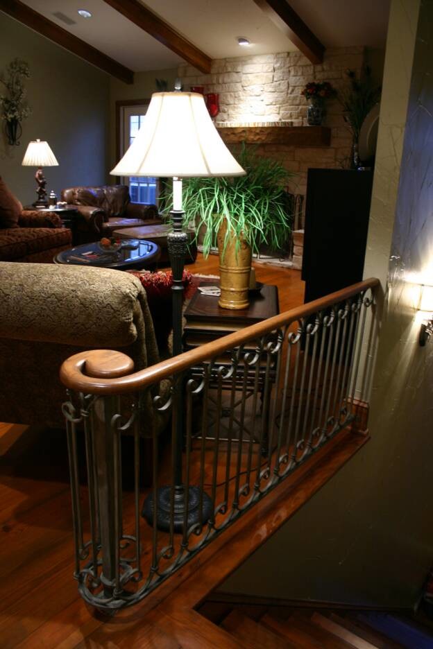 Photo of a small classic wood straight mixed railing staircase in Other with wood risers and feature lighting.
