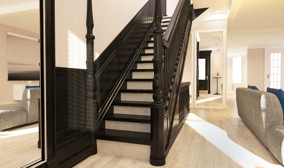 На фото: угловая лестница среднего размера в викторианском стиле с крашенными деревянными ступенями и крашенными деревянными подступенками