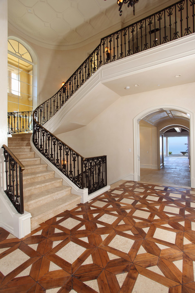 Staircase - large mediterranean curved staircase idea in Orange County