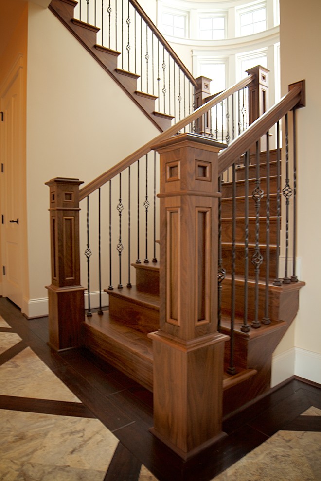 Staircase - transitional wooden u-shaped staircase idea in Other with wooden risers