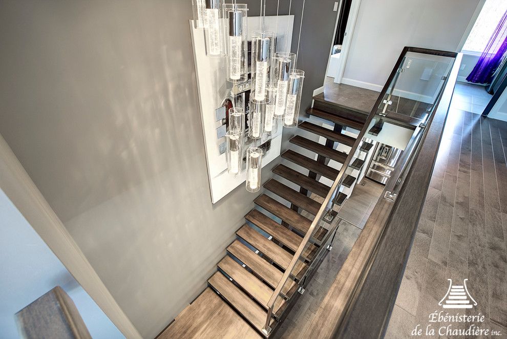 Inspiration for a mid-sized modern wooden l-shaped staircase remodel in Other with wooden risers