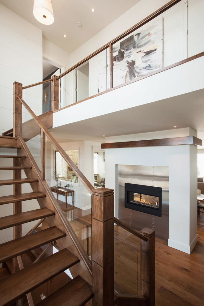 Источник вдохновения для домашнего уюта: огромная угловая лестница в современном стиле с деревянными ступенями без подступенок