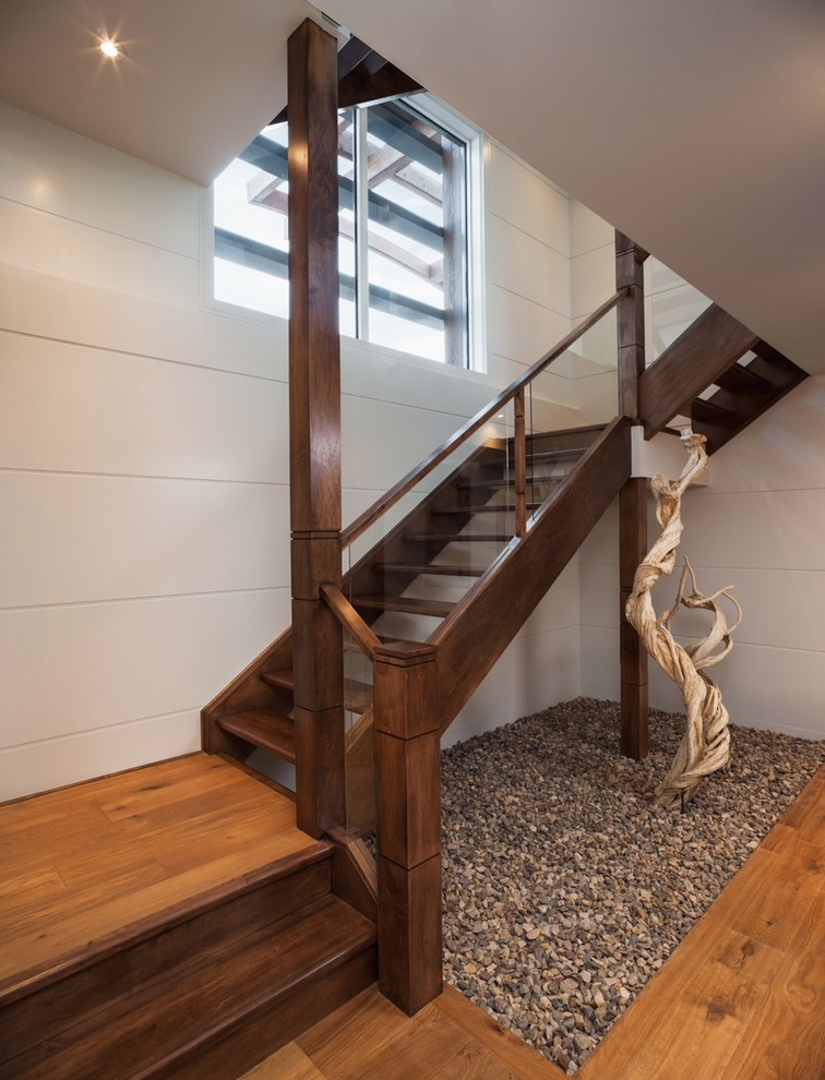 Example of a huge trendy wooden l-shaped open staircase design in Calgary