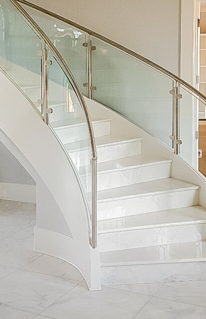 Photo of a large modern curved staircase in Atlanta.