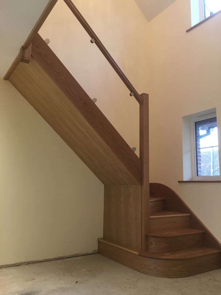 Photo of a medium sized modern staircase in Essex.