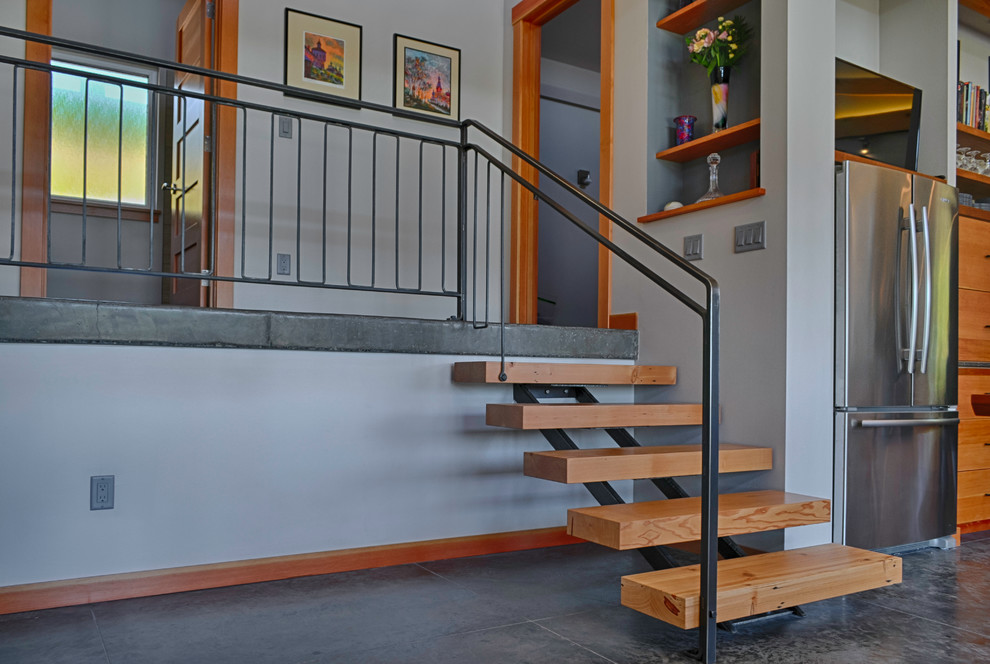 Expansive contemporary wood floating staircase in Seattle with open risers.