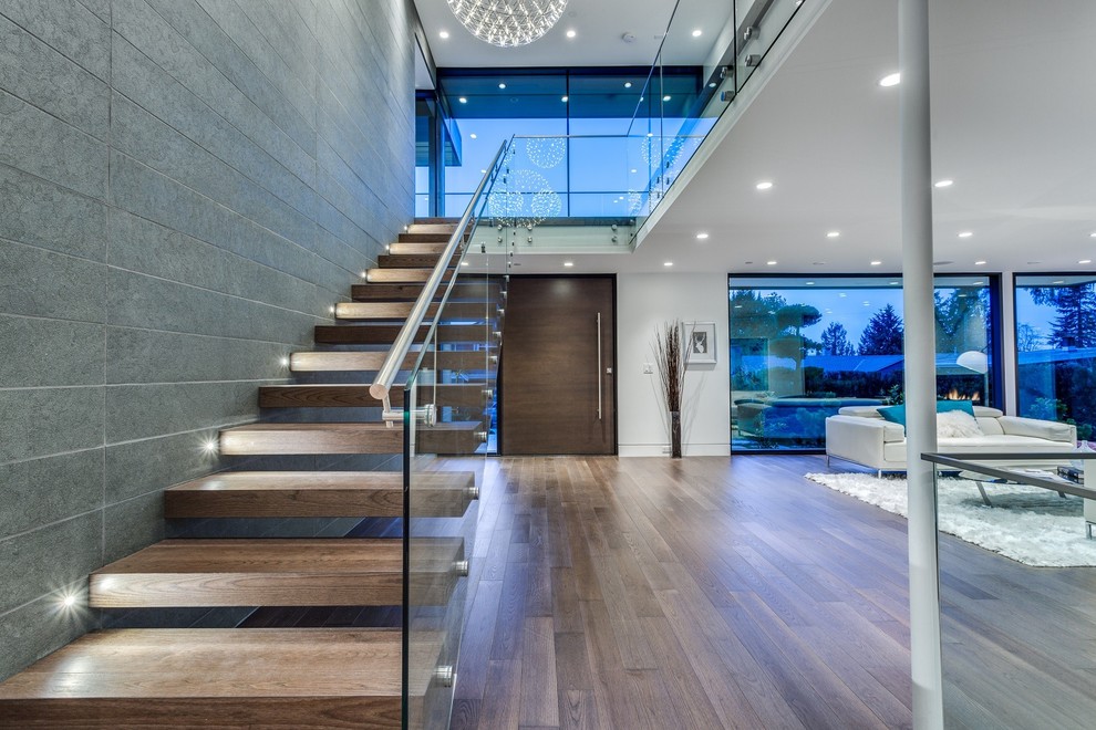 Imagen de escalera recta minimalista de tamaño medio sin contrahuella con escalones de madera