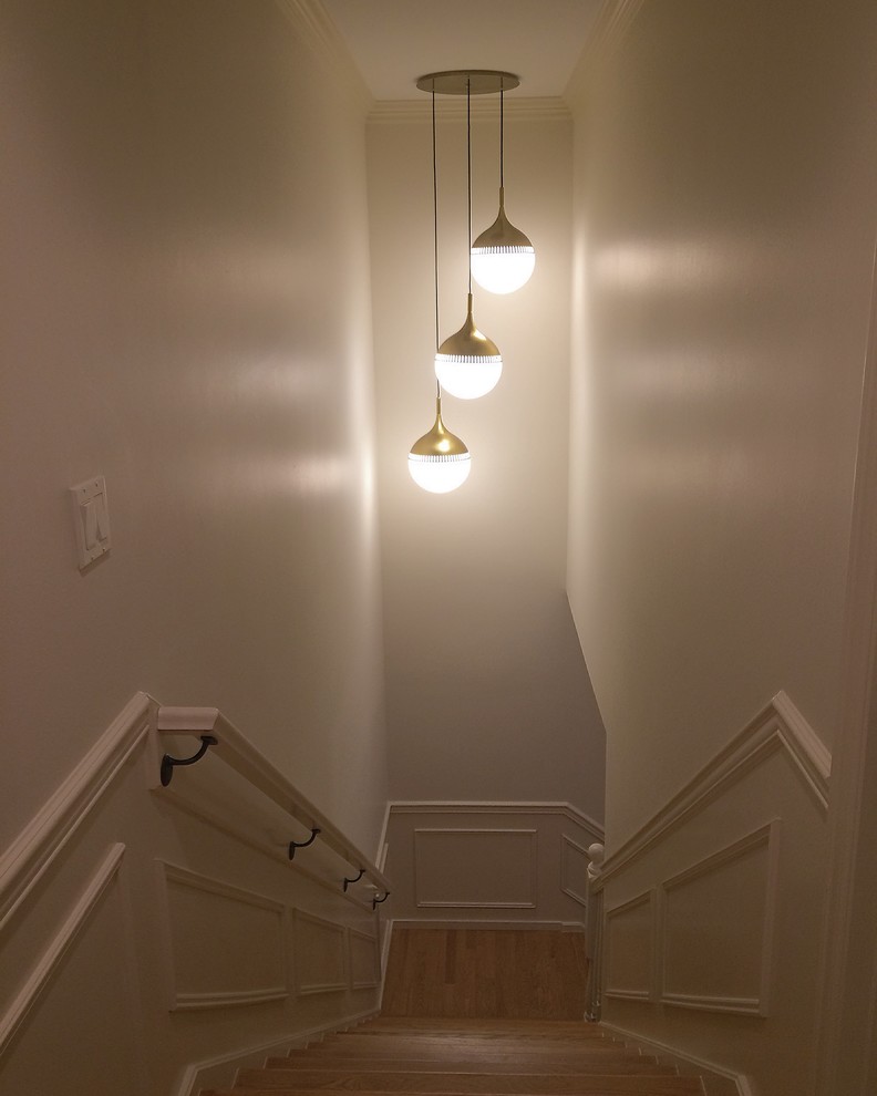 Custom brass fixture for a tall stairwell - Contemporary - Staircase ...