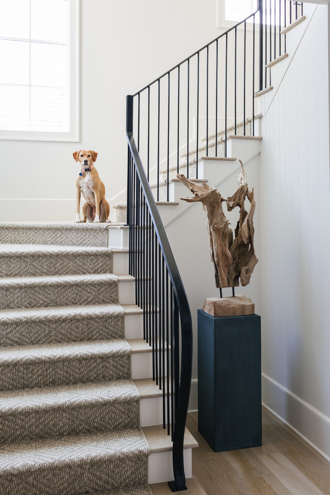 Inspiration for a medium sized traditional wood u-shaped metal railing staircase in Atlanta with painted wood risers.