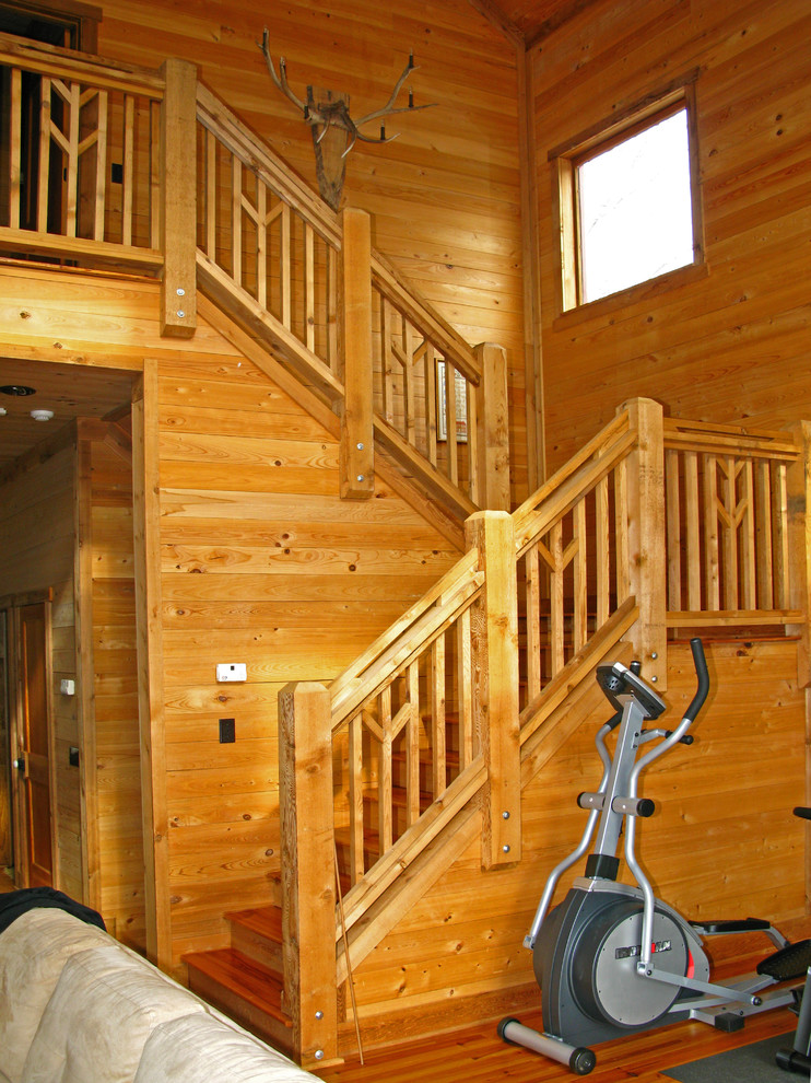 Ejemplo de escalera en U rural de tamaño medio con escalones de madera y contrahuellas de madera